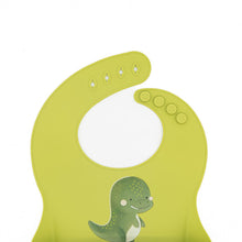 Cargar imagen en el visor de la galería, Babero de Silicona con Bolsillo - Cracky El Dinosaurio | SASSI
